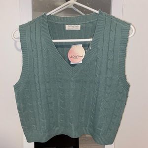 green sweater vest
